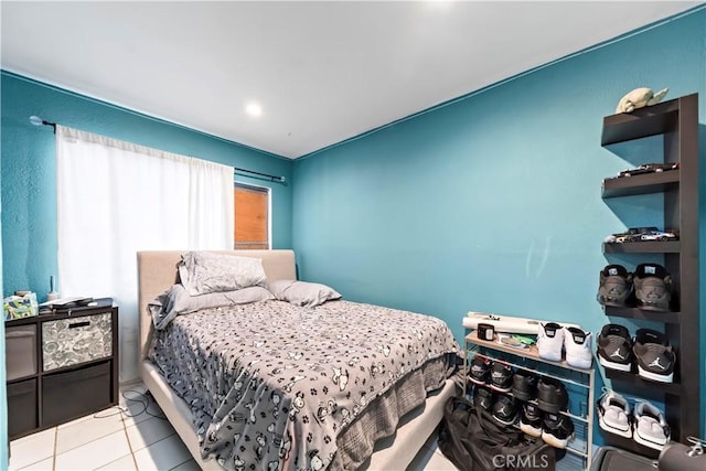 bedroom featuring light tile patterned flooring