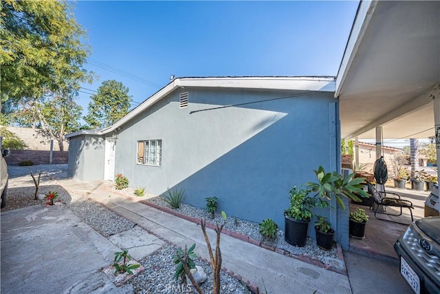 view of home's exterior with a patio