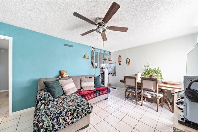 tiled living room featuring ceiling fan and a textured ceiling