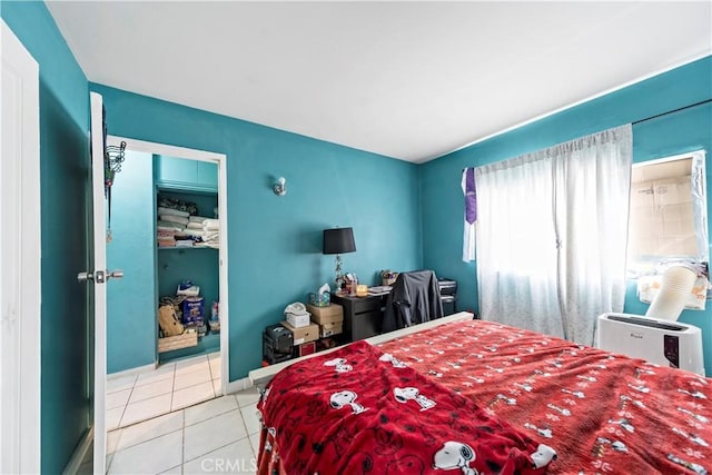 bedroom with light tile patterned floors