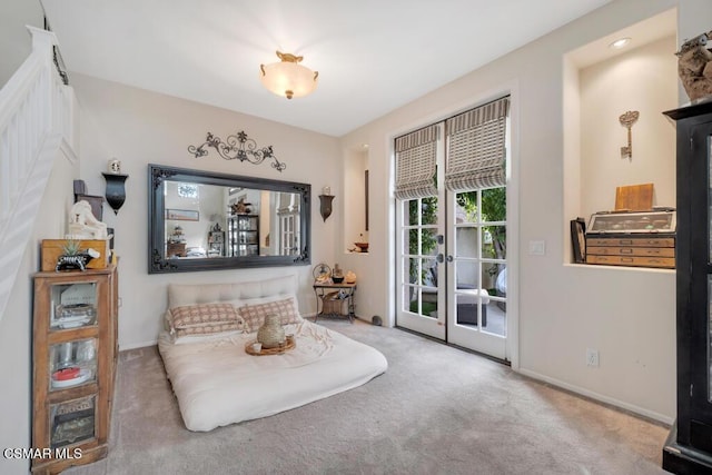 sitting room featuring light colored carpet