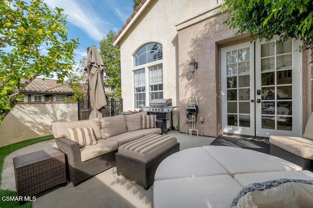 view of patio / terrace with french doors, an outdoor hangout area, and a grill