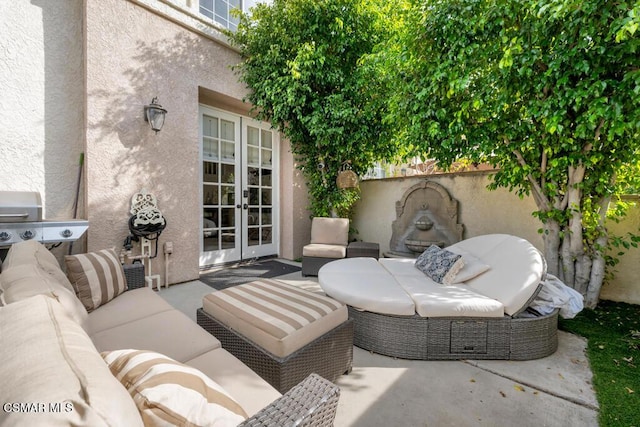 view of patio / terrace with an outdoor living space and french doors