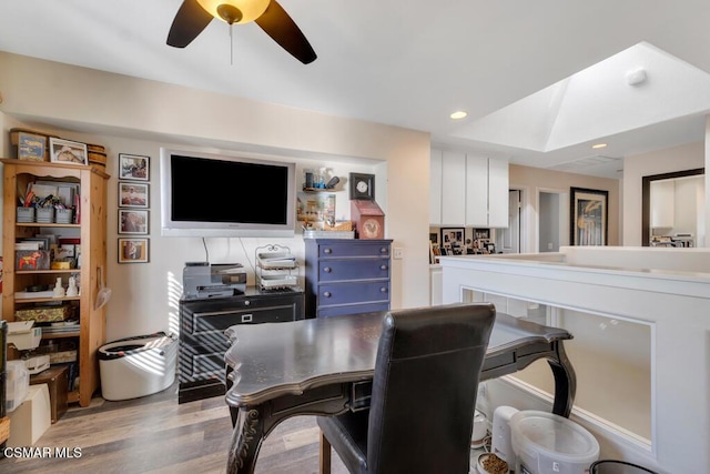 dining area featuring light wood-type flooring and ceiling fan