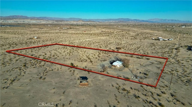 birds eye view of property featuring a mountain view