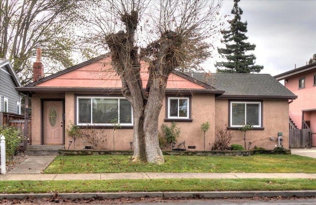 bungalow with a front yard