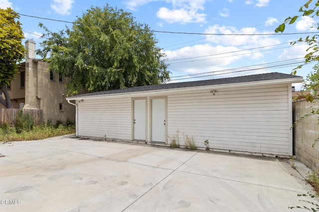 garage with fence