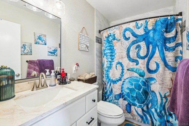 bathroom with vanity, toilet, and a shower with shower curtain