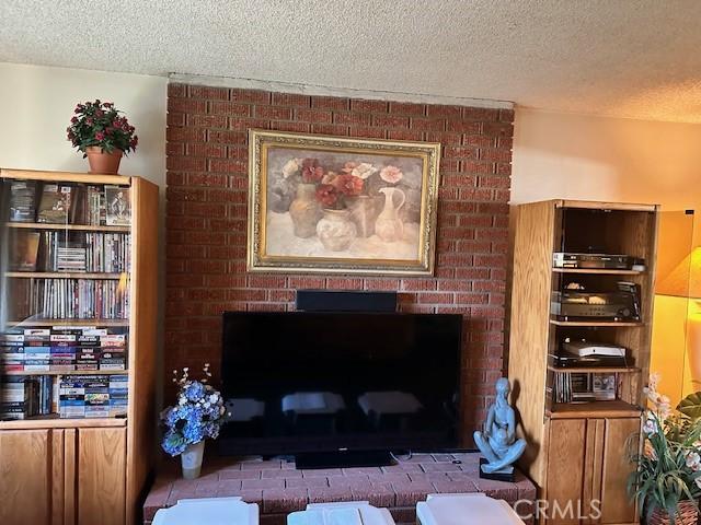 room details with a fireplace and a textured ceiling