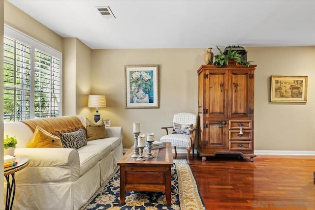 living room with dark hardwood / wood-style flooring