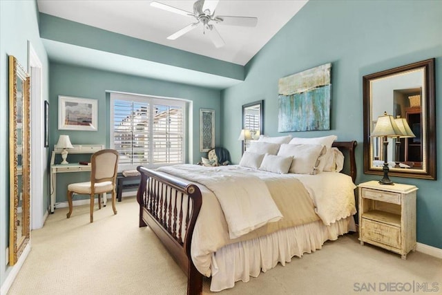 bedroom featuring light carpet, vaulted ceiling, and ceiling fan