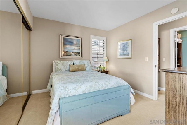 carpeted bedroom with a closet