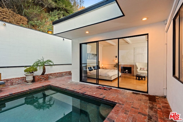 view of swimming pool with a patio