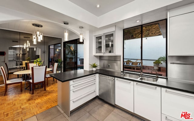 kitchen featuring sink, white cabinetry, dishwasher, and pendant lighting