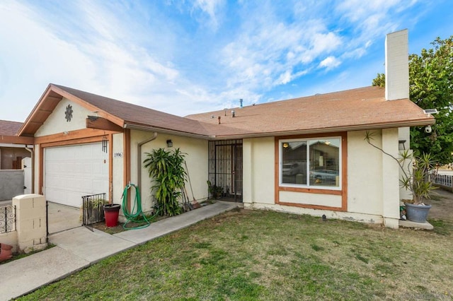 ranch-style home featuring a garage and a front lawn