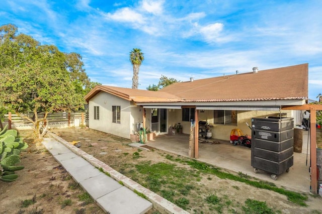 back of property featuring a patio