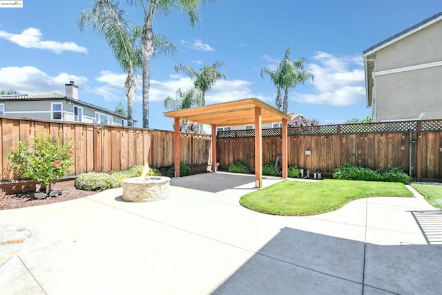 view of patio / terrace with an outdoor fire pit