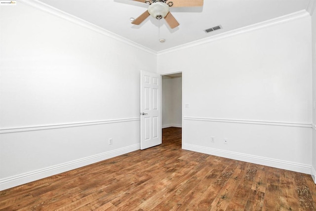 unfurnished room featuring ceiling fan, ornamental molding, and wood-type flooring