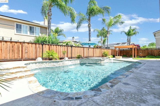 view of pool with pool water feature, an in ground hot tub, and a patio area