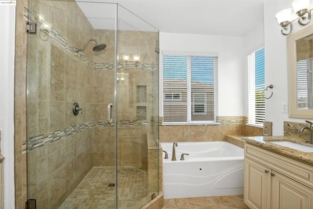 bathroom with independent shower and bath, tile patterned flooring, and vanity