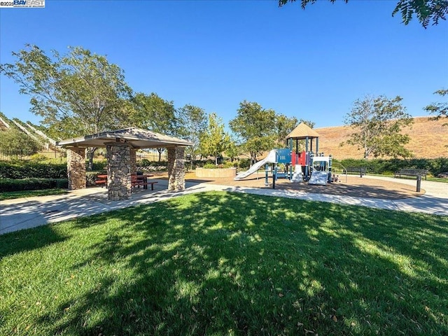 exterior space featuring a playground and a gazebo