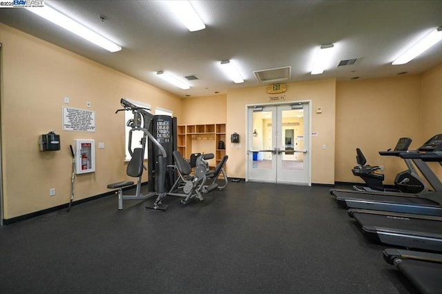 gym with french doors