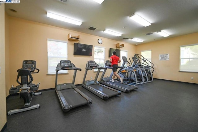 workout area with a wall mounted AC