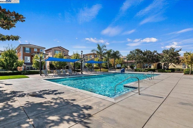 view of swimming pool featuring a patio area