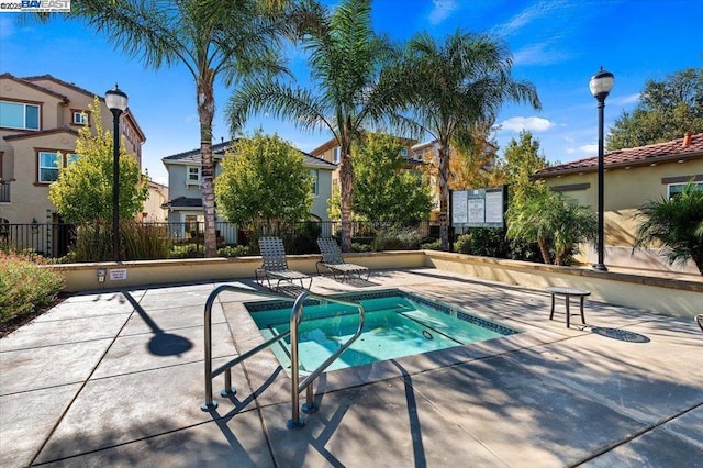 view of swimming pool with a patio area