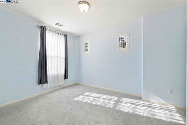 empty room with light colored carpet