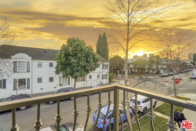 view of balcony at dusk