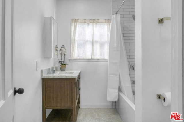 bathroom with vanity, tile patterned floors, and shower / bathtub combination with curtain