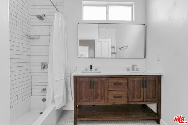 bathroom featuring shower / bath combo with shower curtain and vanity