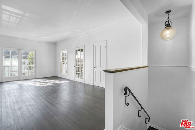 unfurnished living room featuring dark hardwood / wood-style floors