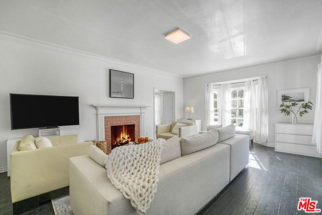 living room featuring a brick fireplace, dark hardwood / wood-style flooring, and crown molding