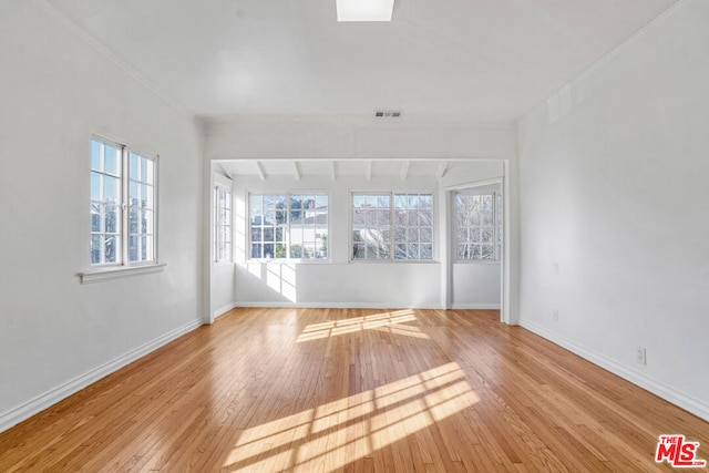 spare room with light hardwood / wood-style floors