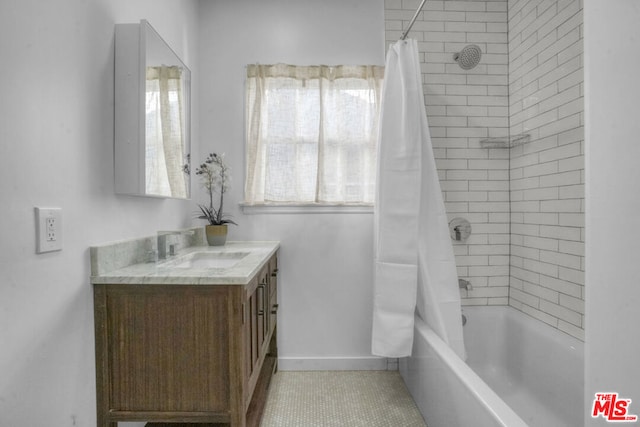 bathroom featuring vanity, shower / bath combo, and tile patterned flooring