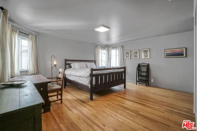 bedroom with light hardwood / wood-style floors