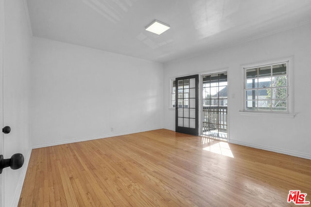 spare room featuring light wood-type flooring