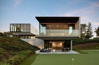 rear view of house featuring a balcony, outdoor lounge area, and a patio