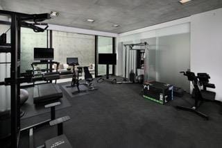 exercise room with floor to ceiling windows