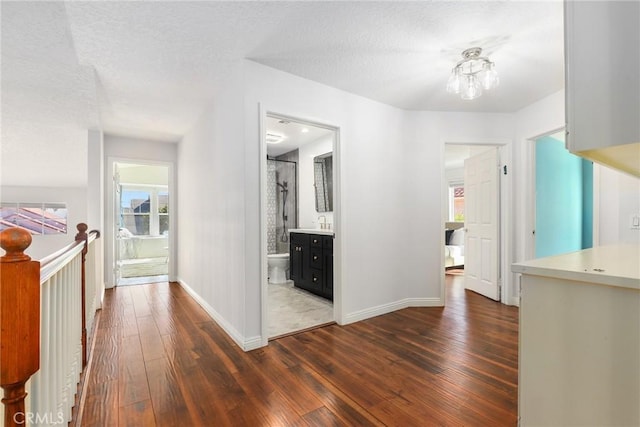 hallway featuring dark hardwood / wood-style flooring