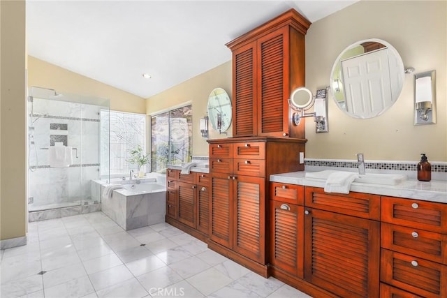 bathroom with vanity, separate shower and tub, and lofted ceiling