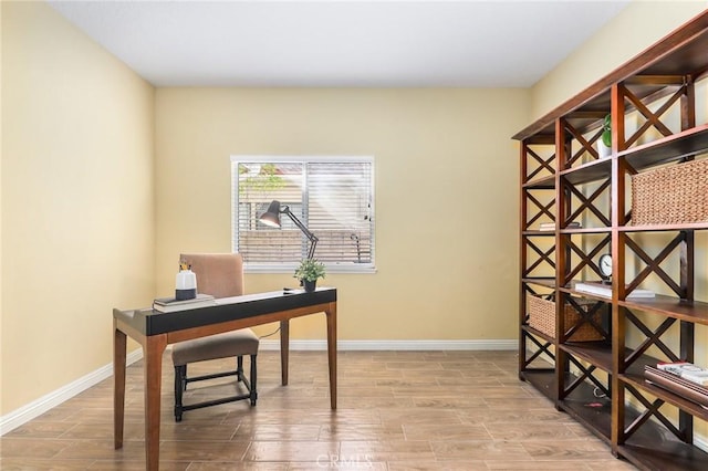 office with light wood-type flooring