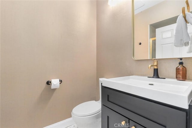 bathroom with vanity and toilet