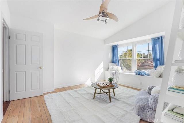 sitting room featuring lofted ceiling, hardwood / wood-style floors, and ceiling fan