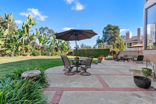 view of patio featuring outdoor dining area