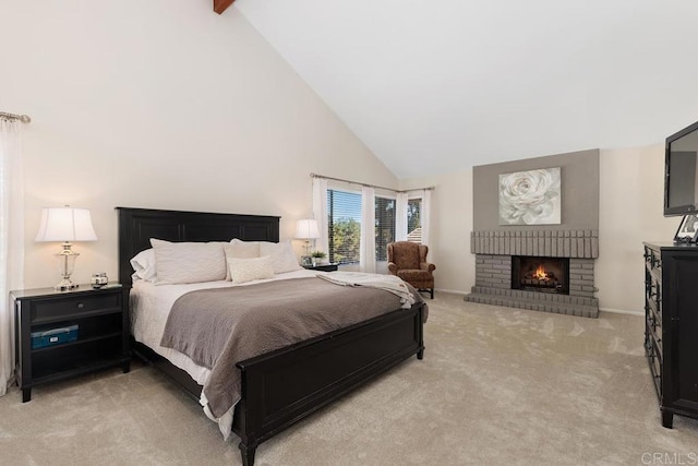 bedroom featuring light carpet, high vaulted ceiling, a fireplace, and baseboards