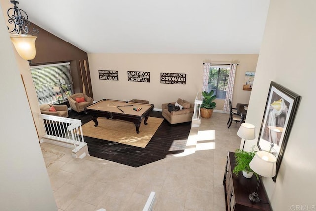 living room featuring lofted ceiling and light tile patterned floors