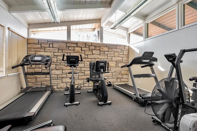 exercise room featuring vaulted ceiling